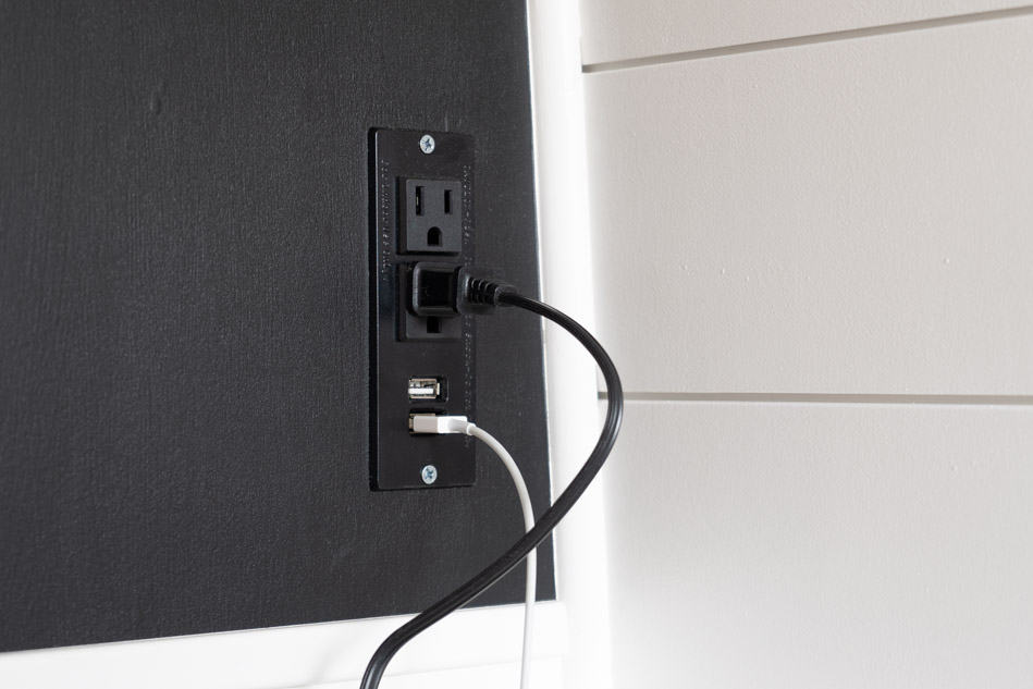 Electrical outlet in black wall