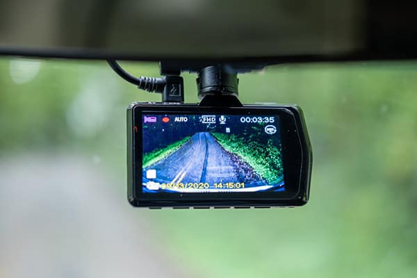 Dashcam on windshield of van