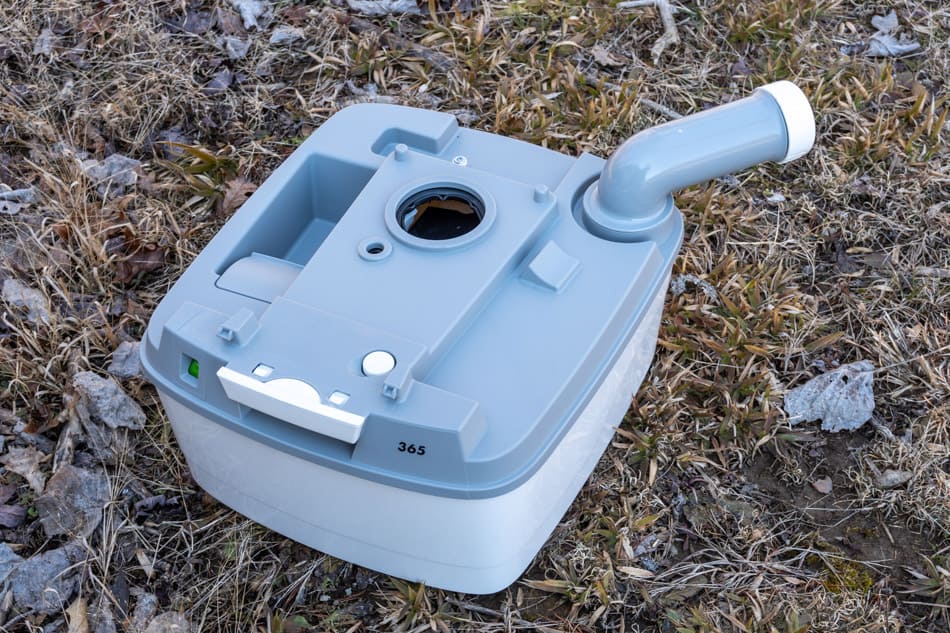 Cassette toilet waste tank sitting in grass